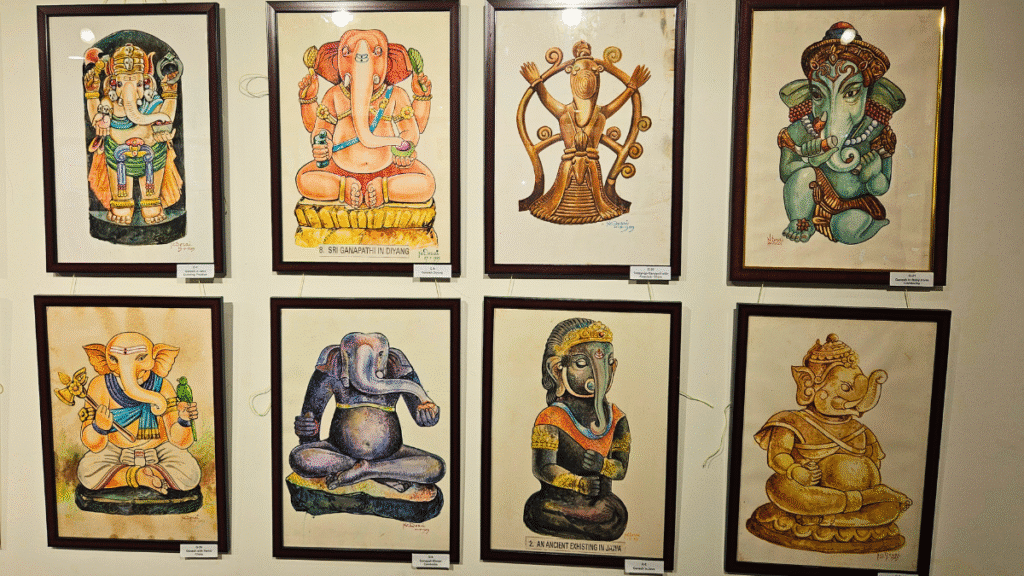 A wall of N.C. Desai’s paintings depicting global forms of Lord Ganesha, including Javanese, Thai, and Indian interpretations, displayed at the Hubballi Art Exhibition.