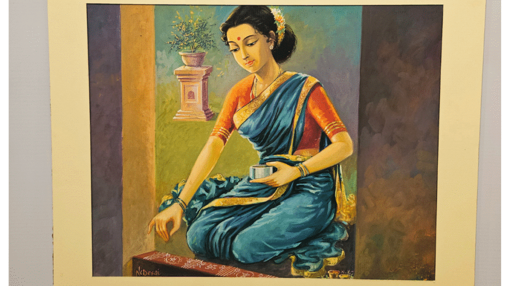 A traditional Indian woman creating a rangoli, painting by artist N.C. Desai displayed at the Hubballi Art Exhibition.