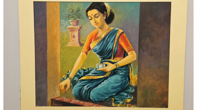 A traditional Indian woman creating a rangoli, painting by artist N.C. Desai displayed at the Hubballi Art Exhibition.