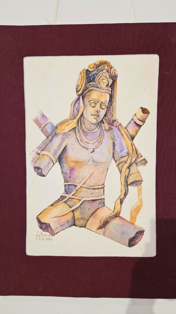 A painting by N.C. Desai depicting a broken Hindu deity statue with missing arms, symbolizing resilience of divinity despite decay, displayed at the Hubballi Art Exhibition.